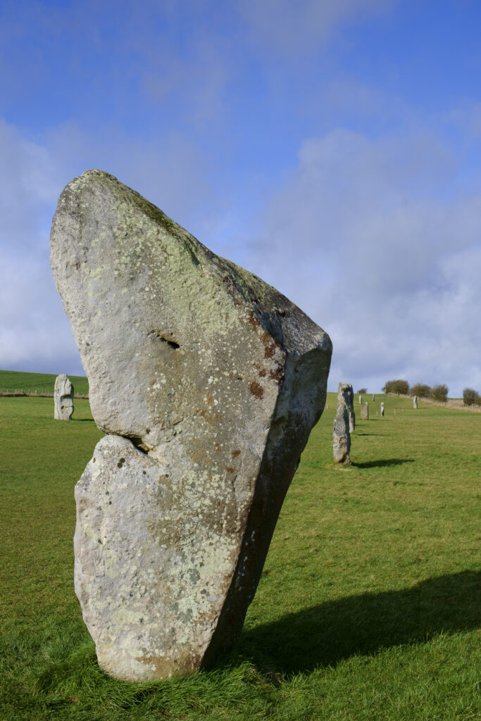 England, Wiltshire, Stonehenge & Avebury World Heritage Site (WHS). Prehistoric standing stones situated along the Avenue leading to Avebury Stone Circle from West Kennet Long Barrow.