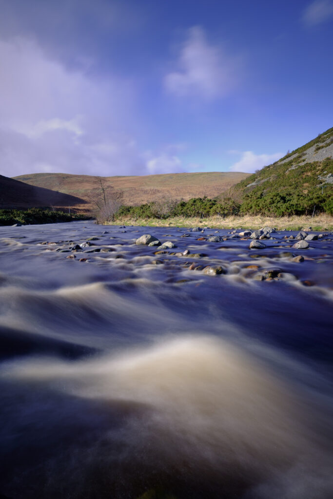 England, Northumberland, Northumberland National Park. The river Breamish, running through the Cheviots and the Breamish valley near the village of Ingram situated within the Northumberland National Park in the northen england county of Northumberland about 8km east of the border with Scotland.