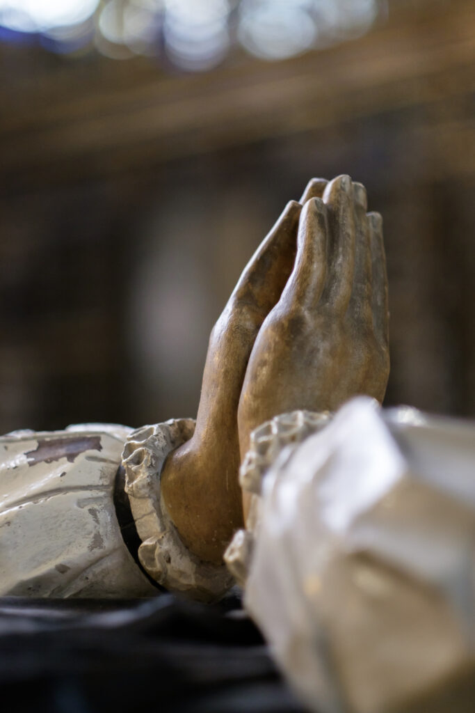 England, North Yorkshire, York Minster Cathedral. Hands praying in York Minster.