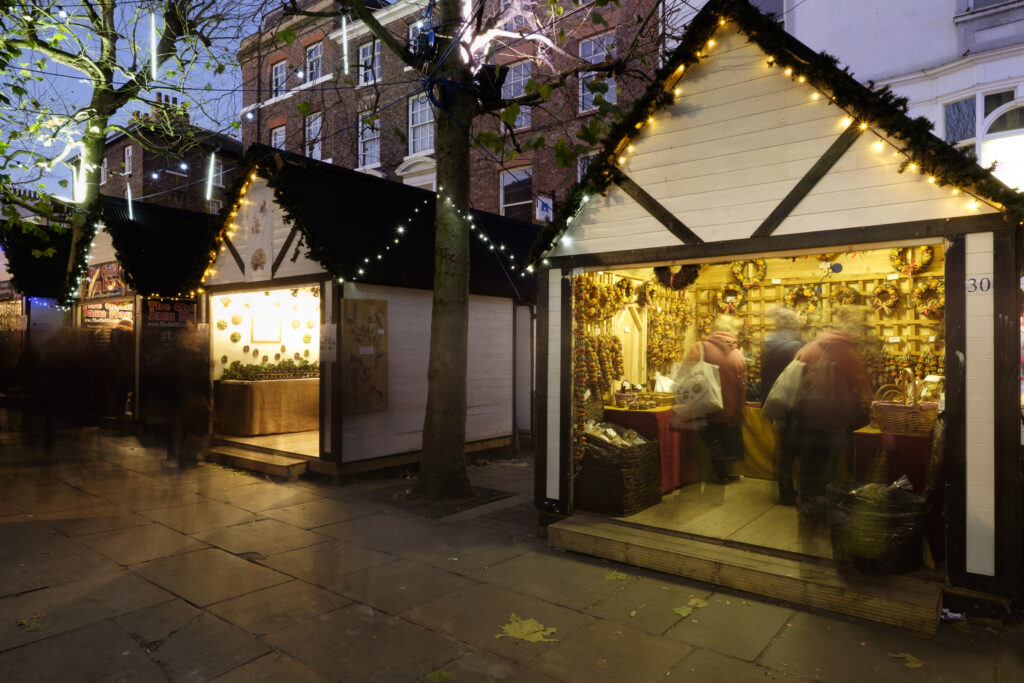 England, North Yorkshire, York City. Christmas Market on Parliament Street.