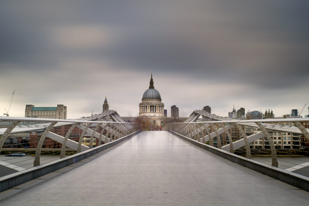 England, Greater London, London City. The London Millennium Footbridge crossing the River Thames with St Paul's Cathedral in the distance.