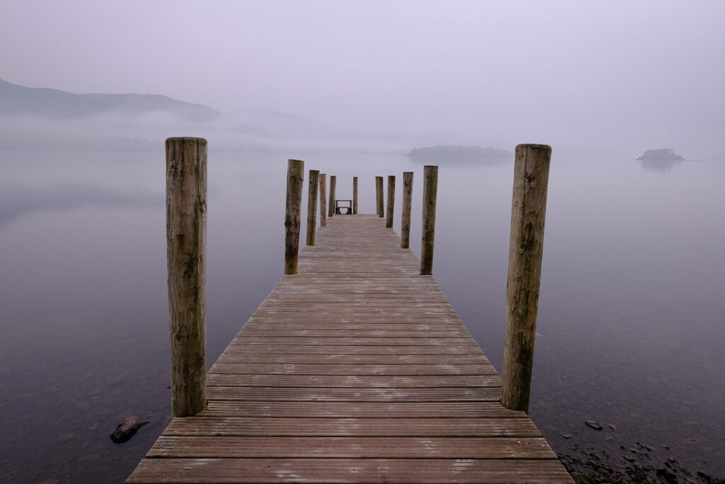 England, Cumbria, Derwentwater. Dawn at Ashness Jetty, Derwentwater. on a misty day in the Lake District National Park.