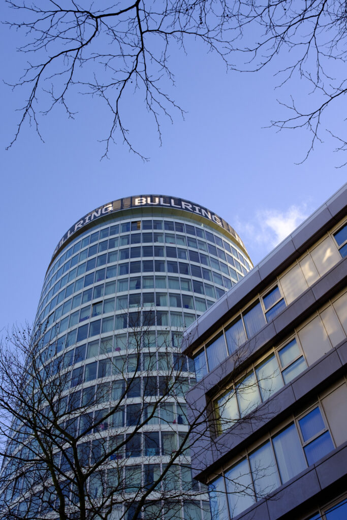 England, West Midlands, Birmingham City. The Rotunda,, a Grade II listed building completed in 1965, which overlooks the Bull Ring shopping centre in Birmingham.
