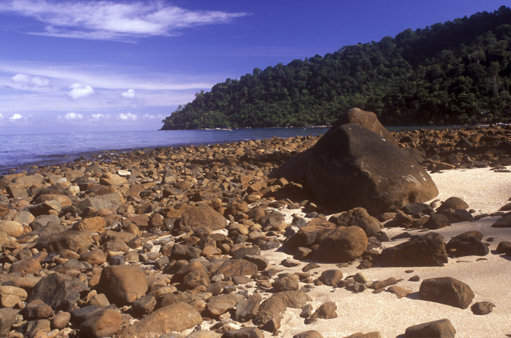Malaysia, Johor, Tioman Island. The rocky landscape of Air Batang Bay, a popular tourist destination found on the island.