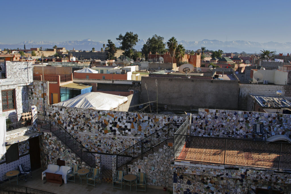 Morocco, Central Morocco, Marrakesh. View looking from a city terrace across the roofs, terraces and city skyline.