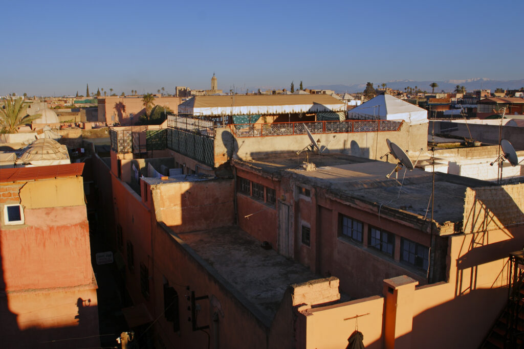 Morocco, Central Morocco, Marrakesh. View looking from a city terrace across the roofs, terraces and city skyline.