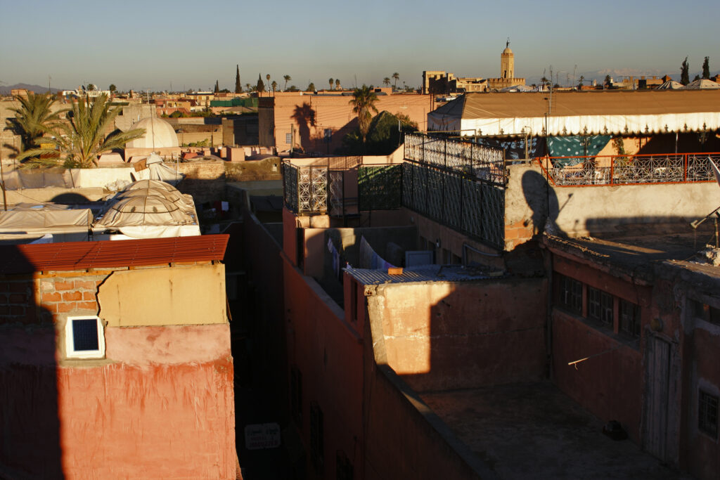 Morocco, Central Morocco, Marrakesh. View looking from a city terrace across the roofs, terraces and city skyline.