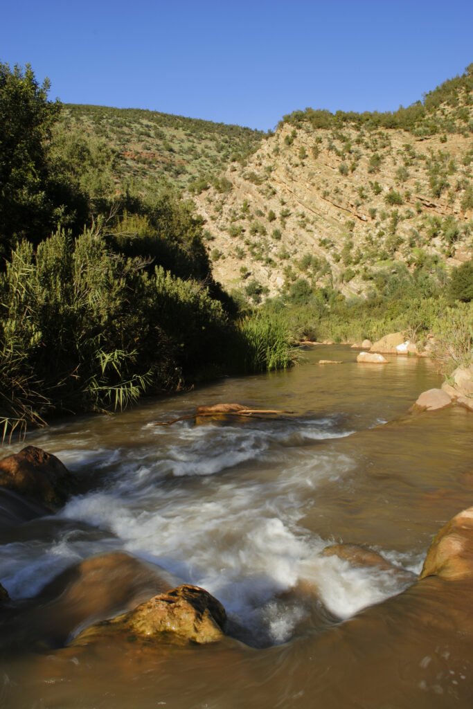 Morocco, Central Morocco, The Ouzoud Gorge. The flowing waters of the river running downstream from the cascades