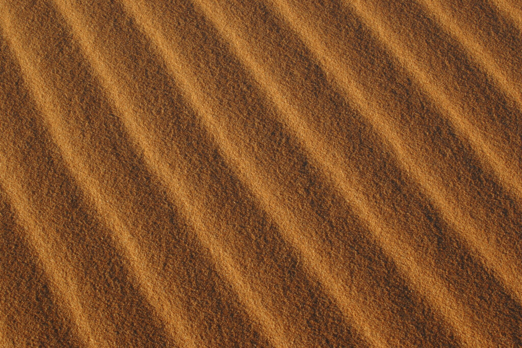 Morocco, Central Morocco, Merzouga. The wind sculptured patterns of sand in the dunes of the Erg Chebbi in the Sahara Desert.