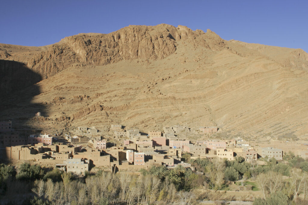 Morocco, Central Morocco, Todra Gorge. The village of Tizgui, dwarfed by the mountains south of the Todra Gorge.