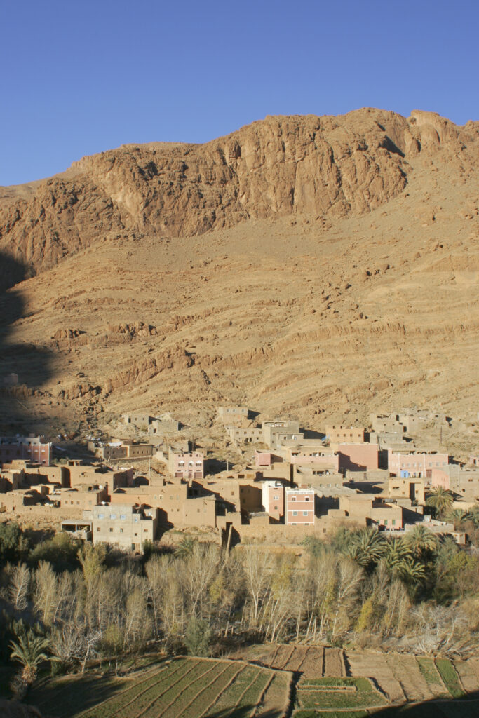 Morocco, Central Morocco, Todra Gorge. The village of Tizgui, dwarfed by the mountains south of the Todra Gorge.