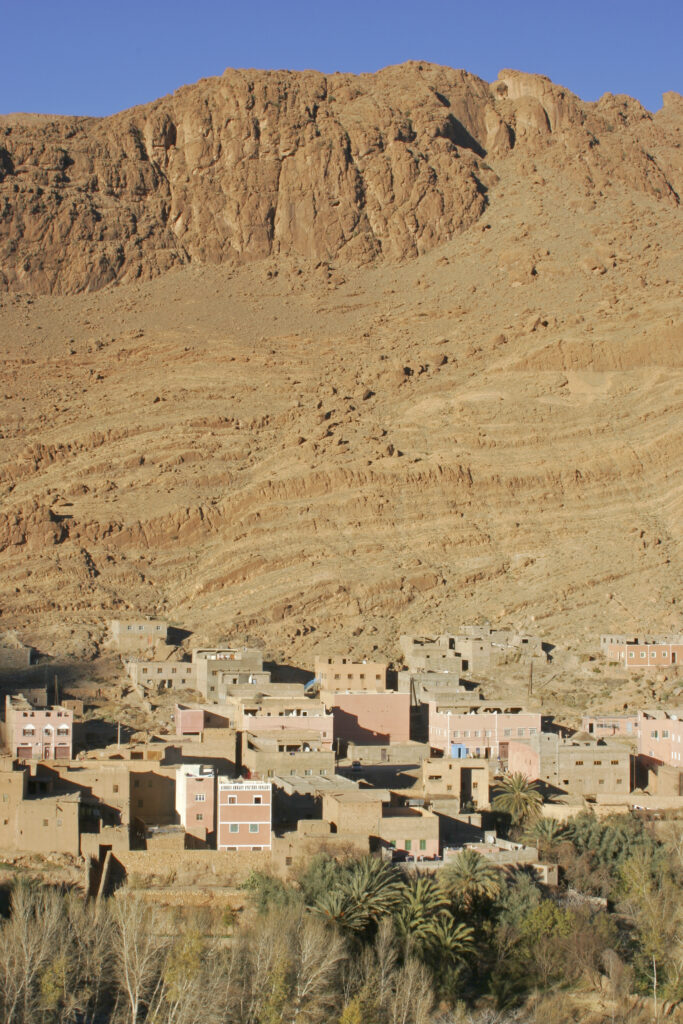 Morocco, Central Morocco, Todra Gorge. The village of Tizgui, dwarfed by the mountains south of the Todra Gorge.