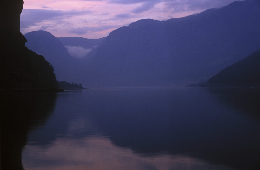 NORWAY, Sogn Og Fjordane, Aurlandsfjordan. The tranquil waters of the Aurlandsfjordan fjord a popular tourist destination
