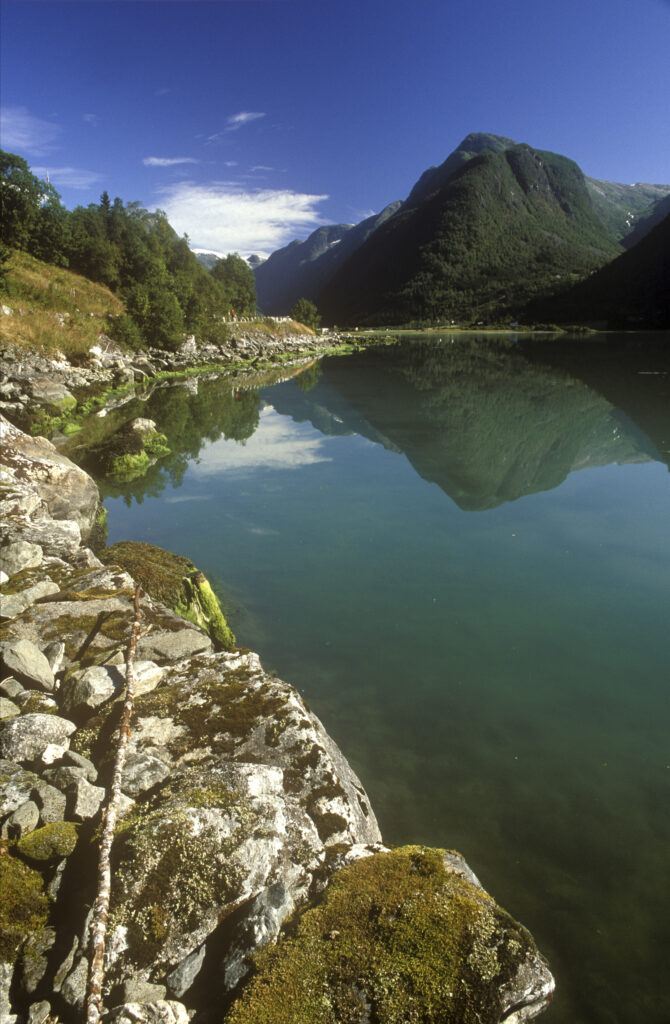 NORWAY, Sogn Og Fjordane, Fjaerland. Mt Middagshaugen reflected in the still waters of Fjaerlandsfjordan