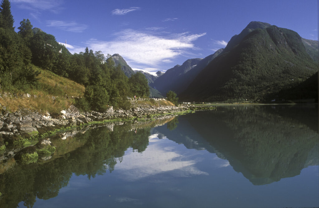 NORWAY, Sogn Og Fjordane, Fjaerland. Mt Middagshaugen reflected in the still waters of Fjaerlandsfjordan
