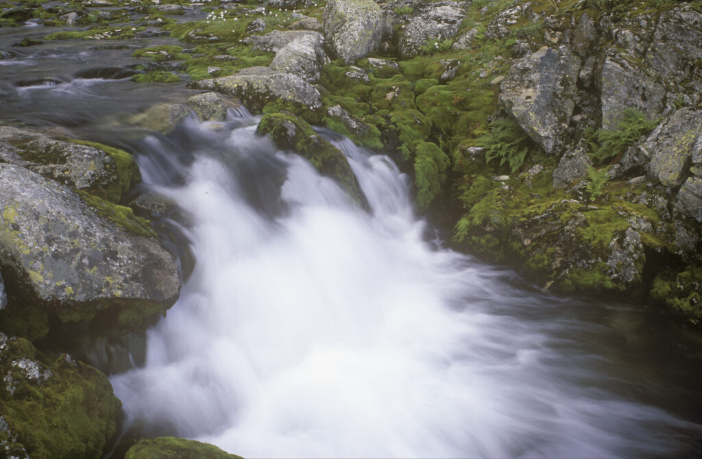 NORWAY, Sogn Og Fjordane, Jostedalsbreen National Park. The fast flowing waters found running downstream of Flatbreen Glacier
