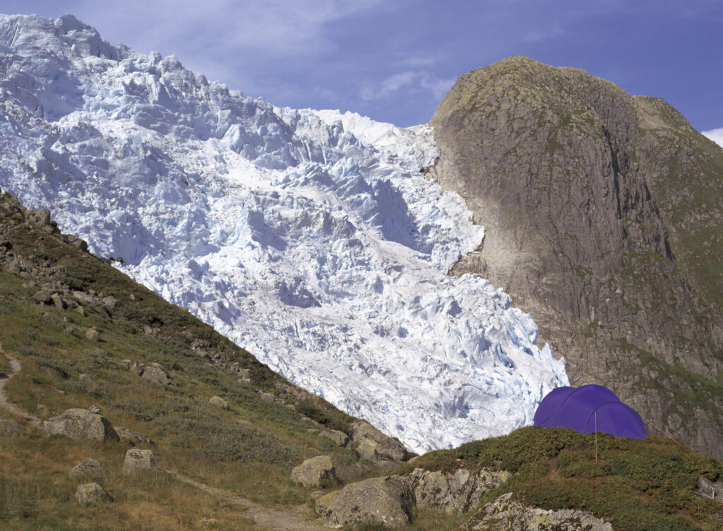NORWAY, Sogn Og Fjordane, Jostedalsbreen National Park. Wild camping by Flatbreen Glacier one of the many to be found in the park.