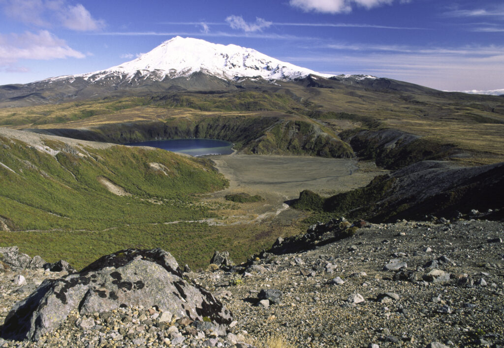 NEW ZEALAND, Central Plateau, Tongariro National Park. View looking towards lower Tama lake and the dormant volcanoe Mt Ruapehu