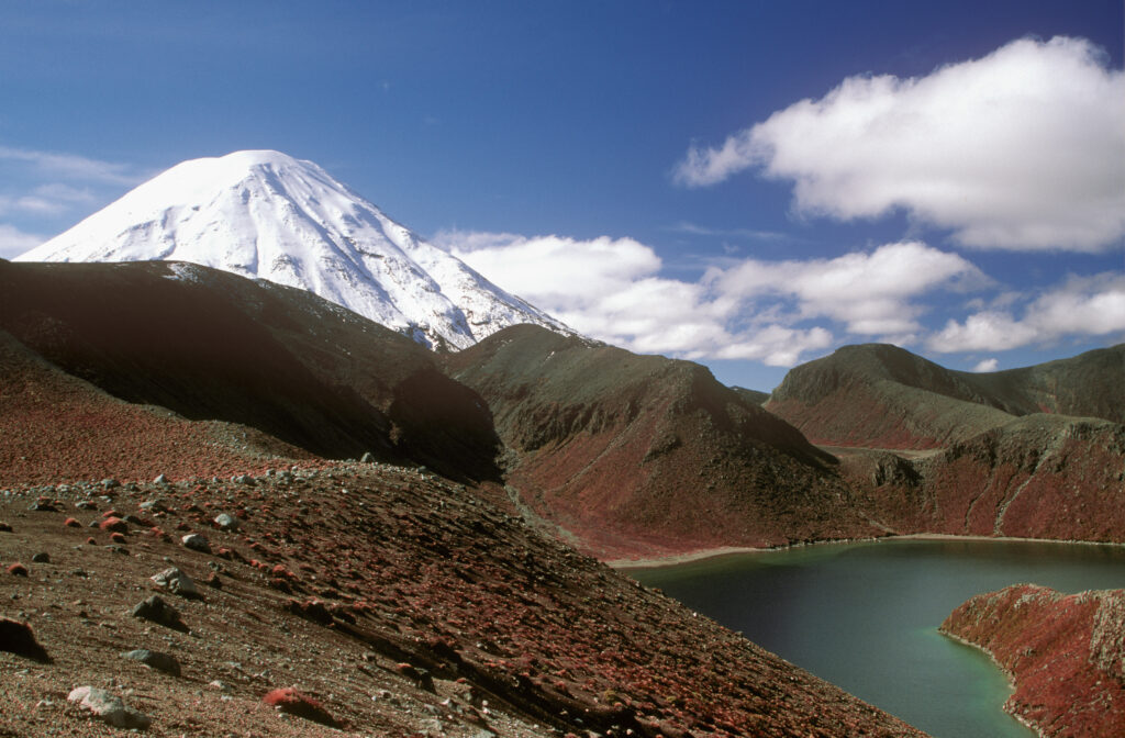 NEW ZEALAND, Central Plateau, Tongariro National Park. Upper Tama lake and lava bombs with the dormant Volcanoe Mt Ngauruhoe