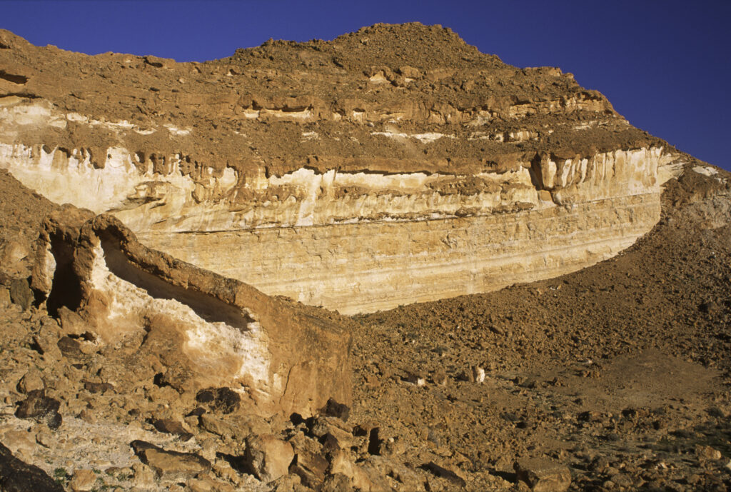 TUNISIA, Chebika Region, Tamerza. The banded cliffs and colourful features of the landscape surrounding the town.