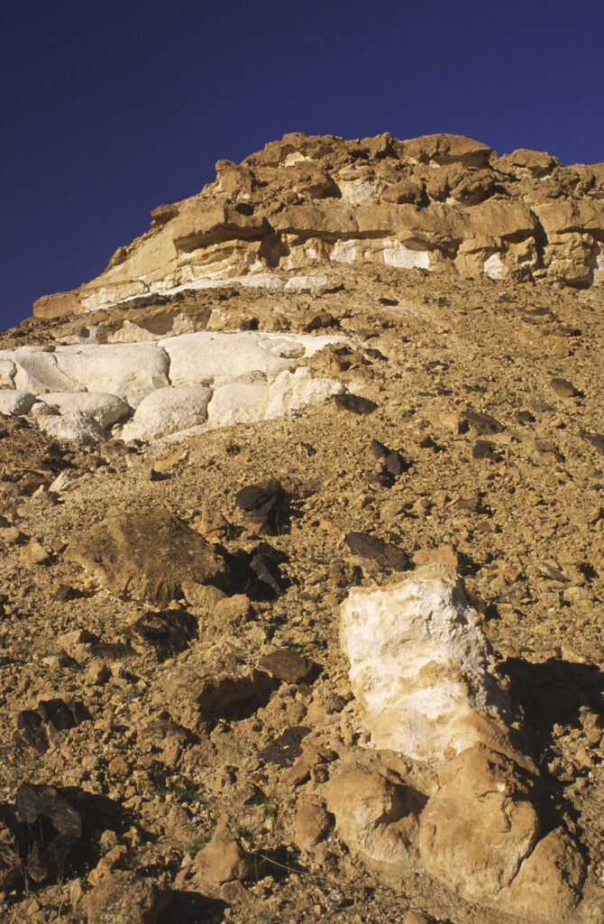 TUNISIA, Chebika Region, Tamerza. The banded cliffs and colourful features of the landscape surrounding the town.