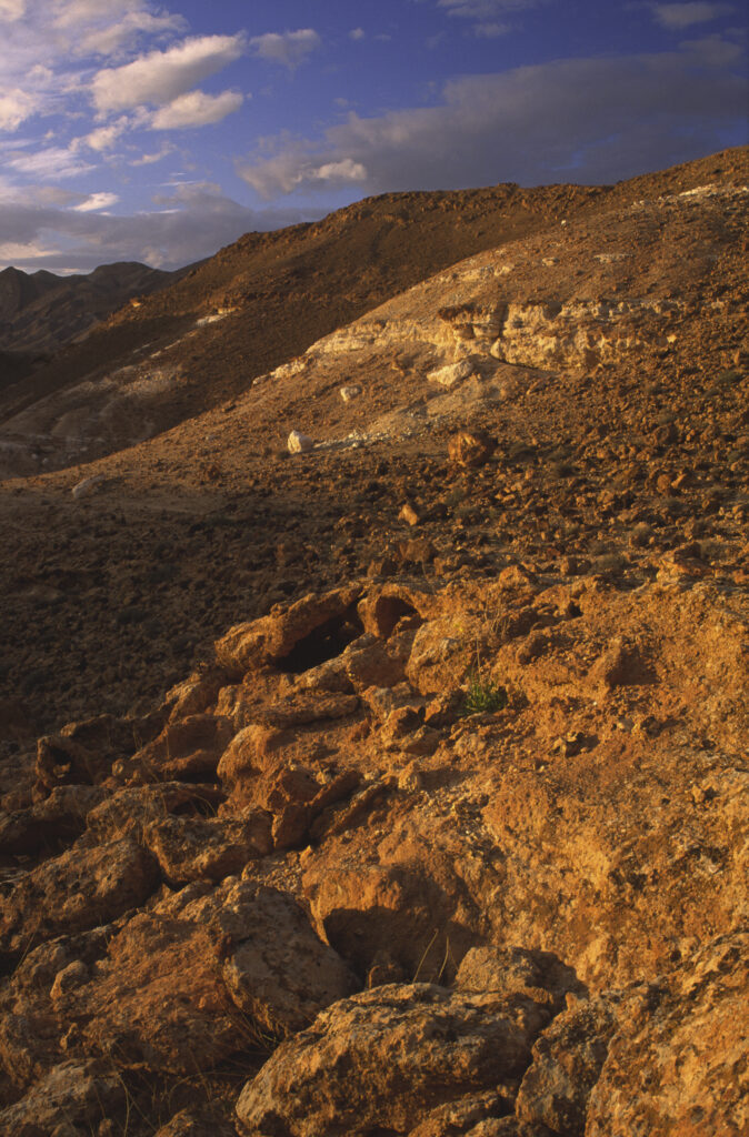TUNISIA, Chebika Region, Tamerza. Soft evening light illuminates the mountainous landscape found near to the town.