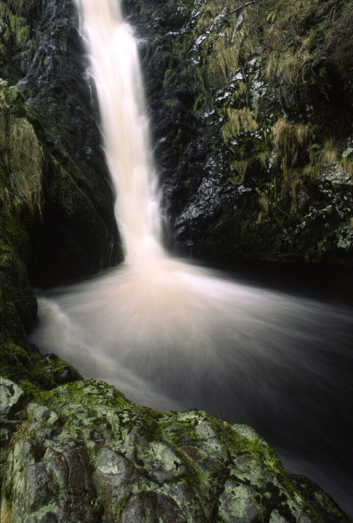 ENGLAND, Northumberland, Ingram. The fast flowing waters of the Linhope Spout Waterfall