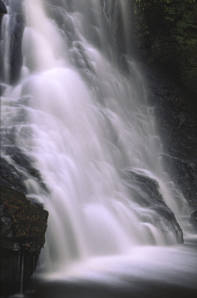 ENGLAND, Northumberland, Bellingham. The flowing waterfall of Hareshaw Linn a popular spot located within Northumberland National Park.