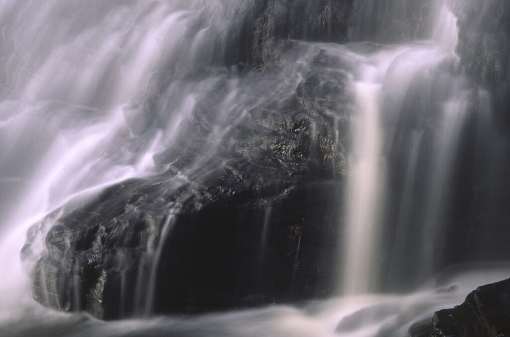 ENGLAND, Northumberland, Bellingham. The flowing waterfall of Hareshaw Linn a popular spot located within Northumberland National Park.