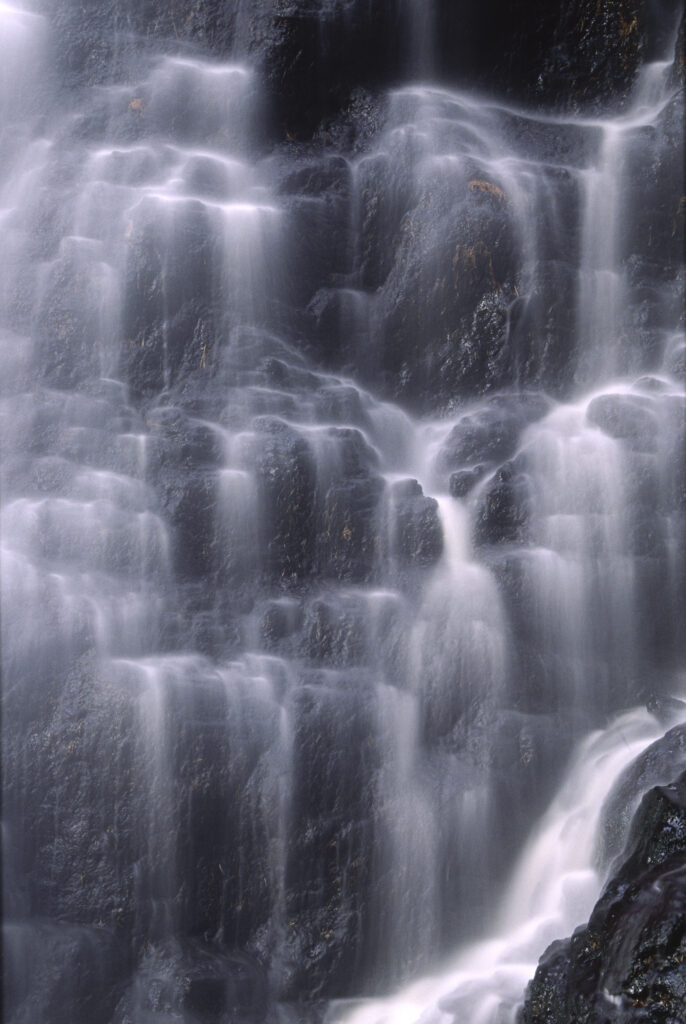 ENGLAND, Northumberland, Bellingham. The flowing waterfall of Hareshaw Linn a popular spot located within Northumberland National Park.