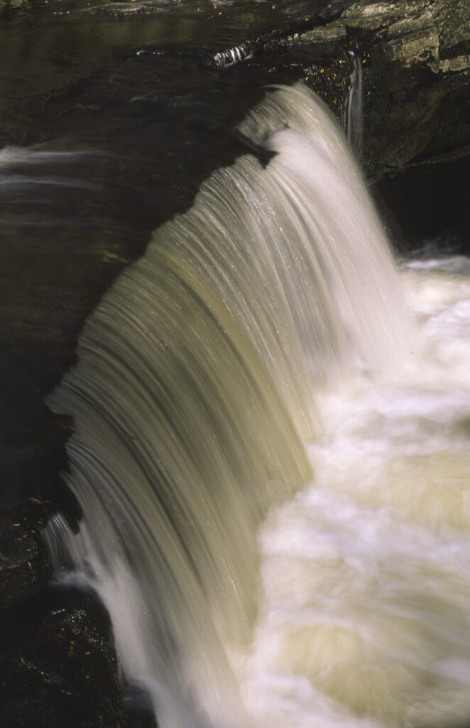 ENGLAND, Yorkshire, Yorkshire Dales National Park. The flowing waters of Stainforth Force
