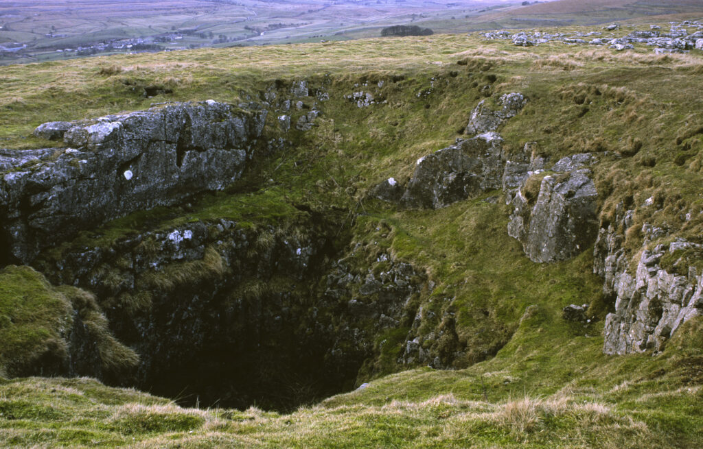 ENGLAND, Yorkshire, Yorkshire Dales National Park. A typical limestone sink hole found in the area of Ribblesdale