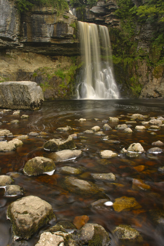 ENGLAND, Yorkshire, Yorkshire Dales National Park. The fast flowing waters of the Thornton Force waterfall, near Ingleton.
