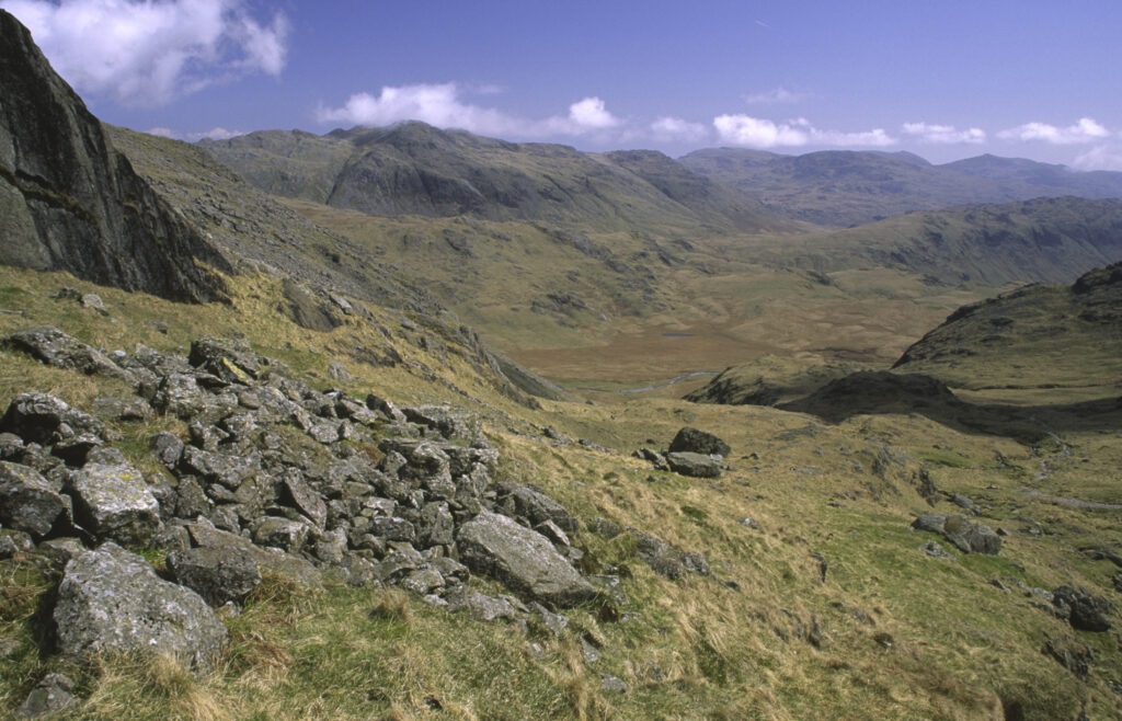 ENGLAND, Cumbria, Lake District National Park. The wild landscape of Upper Eskdale viewed from point below Scafell Pike