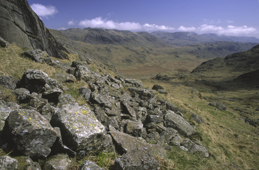ENGLAND, Cumbria, Lake District National Park. The wild landscape of Upper Eskdale viewed from point below Scafell Pike