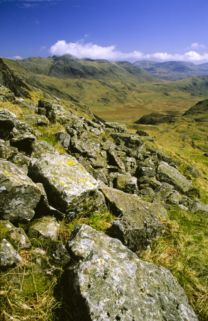 ENGLAND, Cumbria, Lake District National Park. The wild landscape of Upper Eskdale viewed from point below Scafell Pike