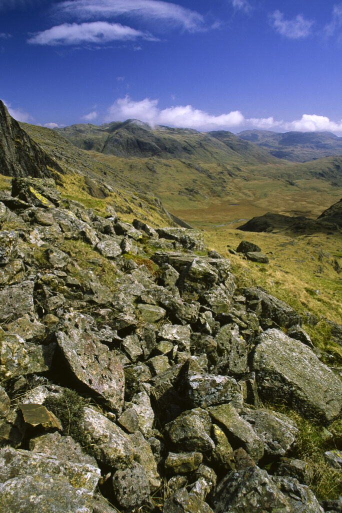 ENGLAND, Cumbria, Lake District National Park. The wild landscape of Upper Eskdale viewed from point below Scafell Pike