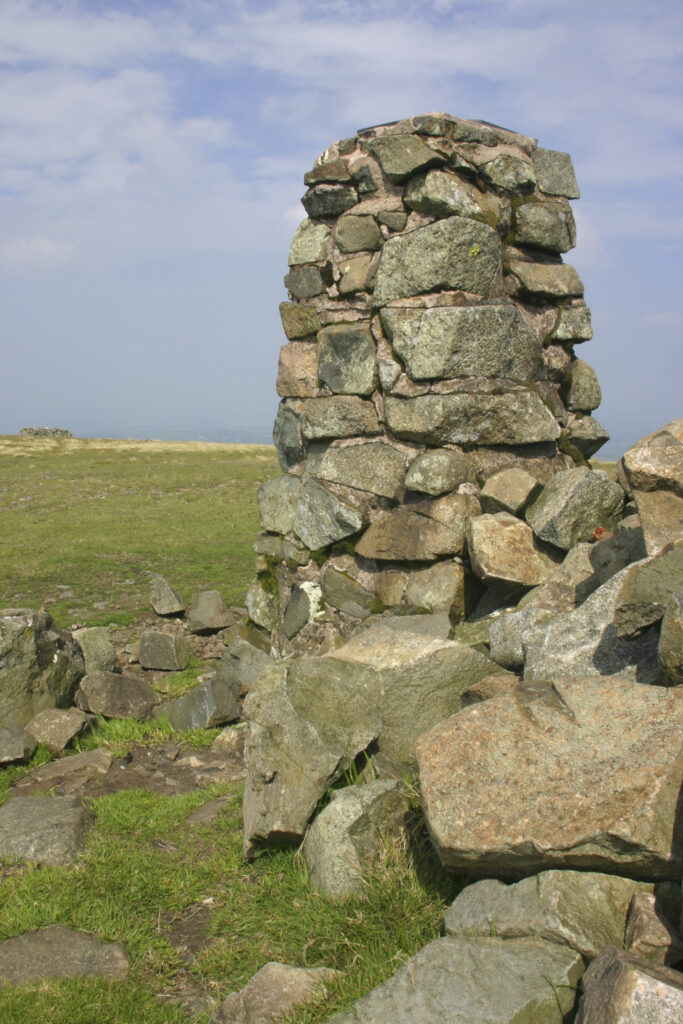 ENGLAND, Cumbria, Lake District National Park. A cairn marks the highest point of the cumbria way track at High Pike 658m