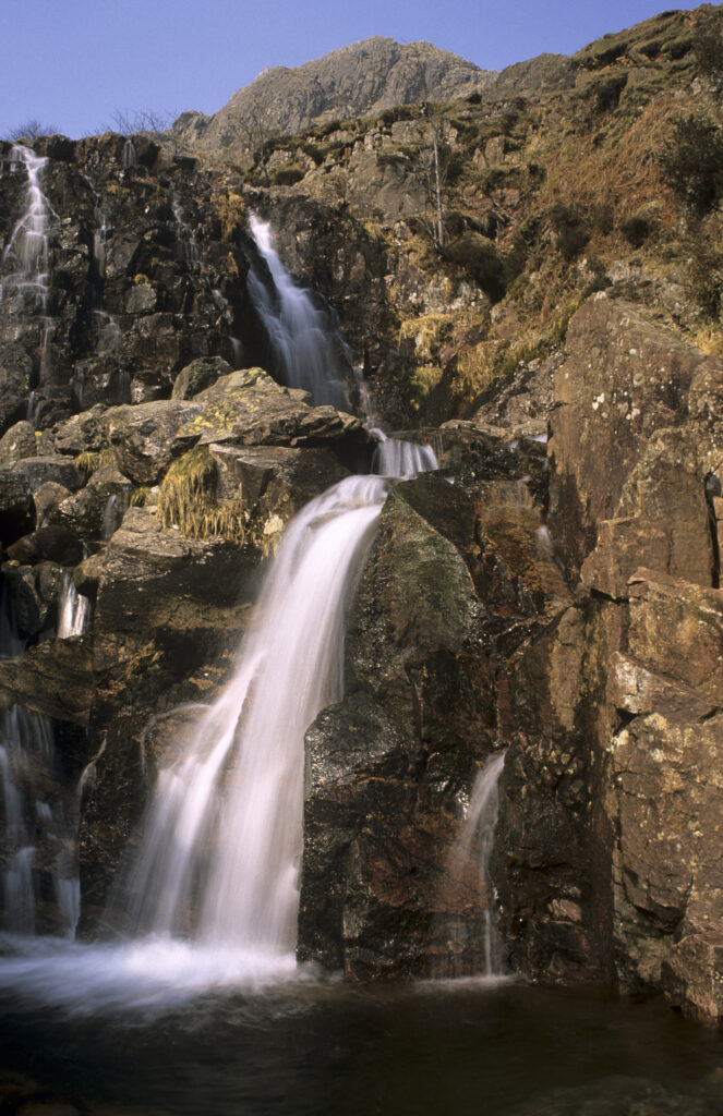 ENGLAND, Cumbria, Lake District National Park. The flowing waterfalls of Dungeon Ghyl Force, Langdale Fell.