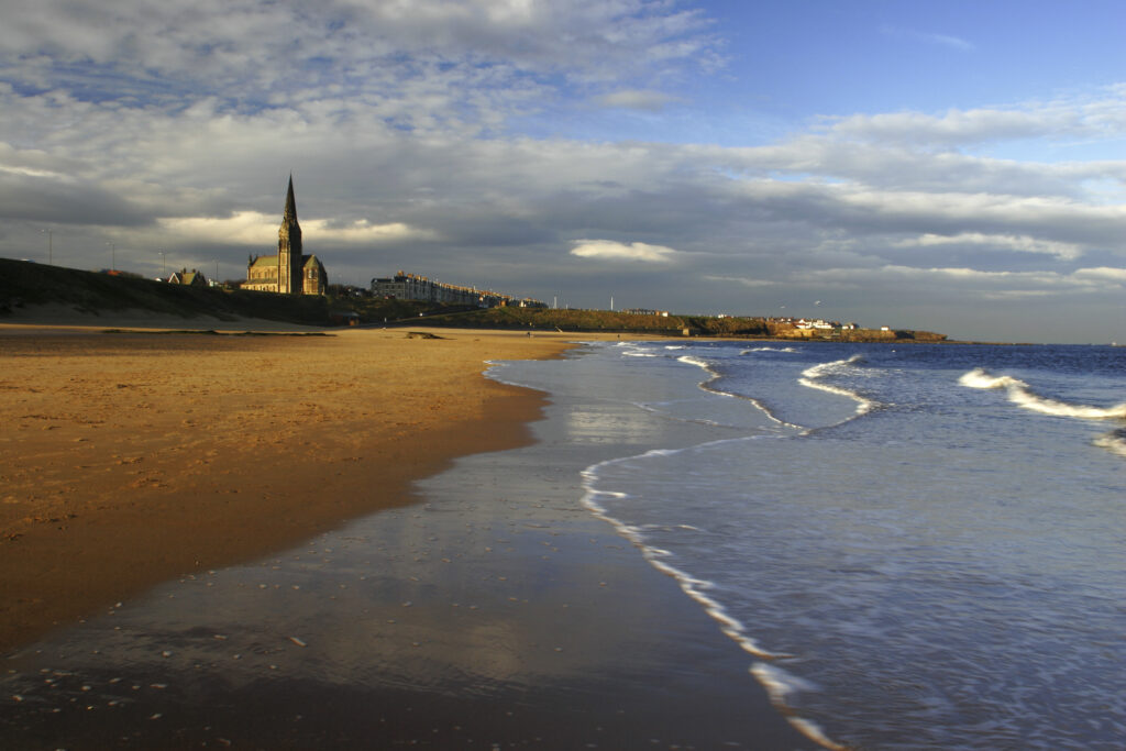 ENGLAND, Tyne and Wear, Tynemouth Longsands. A winters day on the sandy stretch of Tynemouth Longsands near Cullercoats
