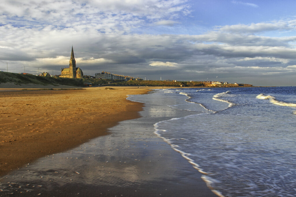 ENGLAND, Tyne and Wear, Tynemouth Longsands. A winters day on the sandy stretch of Tynemouth Longsands near Cullercoats