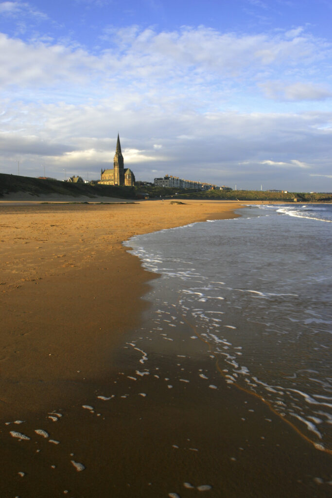 ENGLAND, Tyne and Wear, Tynemouth Longsands. A winters day on the sandy stretch of Tynemouth Longsands near Cullercoats