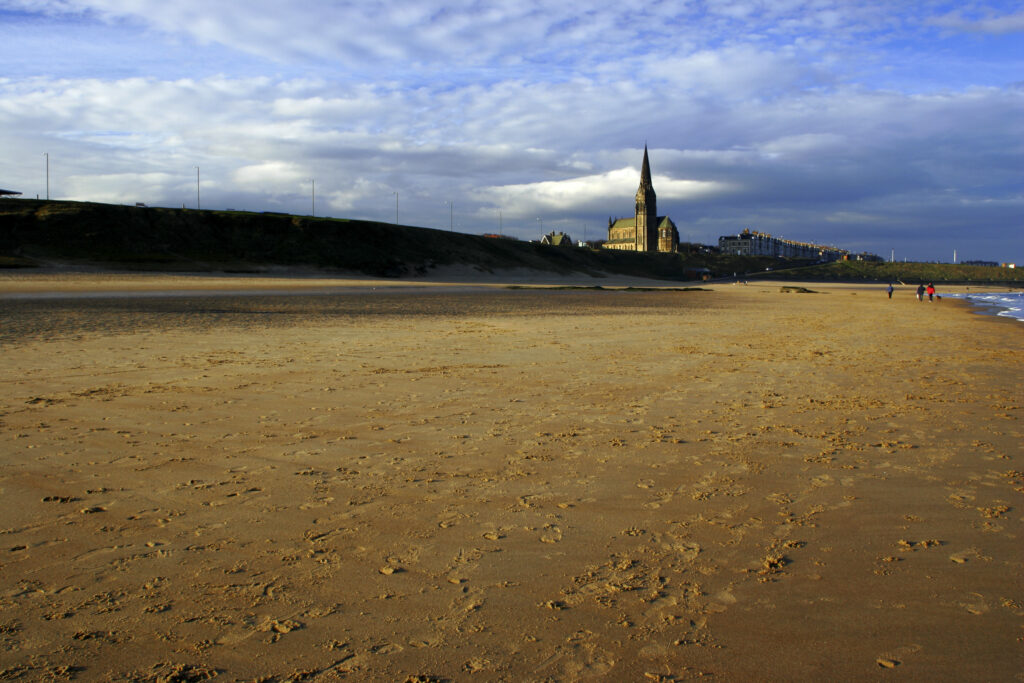 ENGLAND, Tyne and Wear, Tynemouth Longsands. A winters day on the sandy stretch of Tynemouth Longsands near Cullercoats