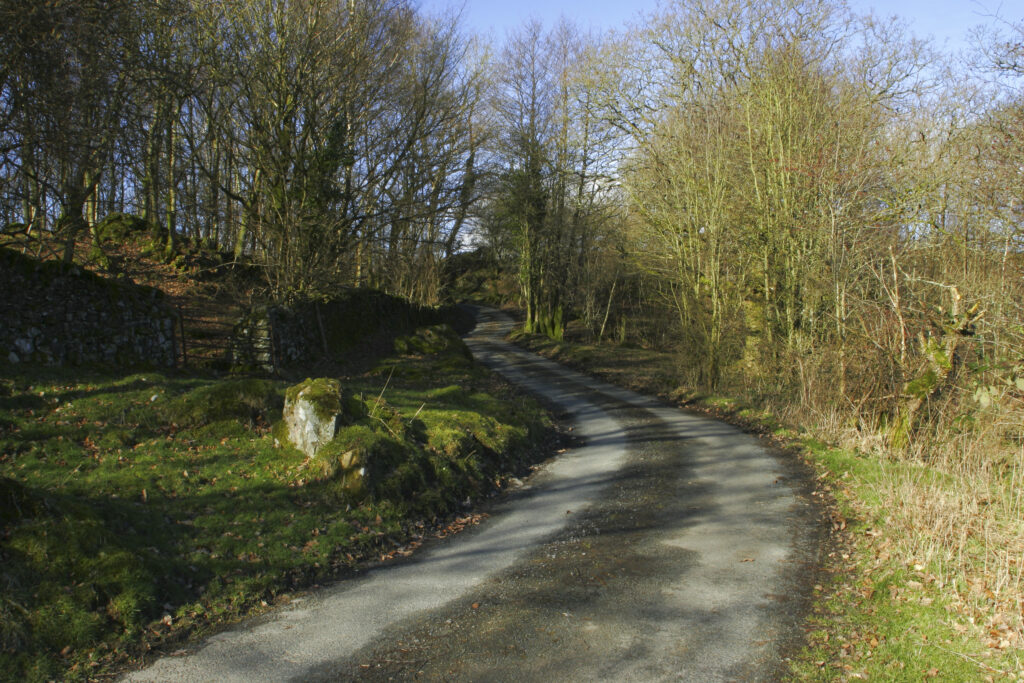 England, Cumbria, Lake District National Park. The Cumbria Way track follows the road from Kendall ground to Kiln Bank