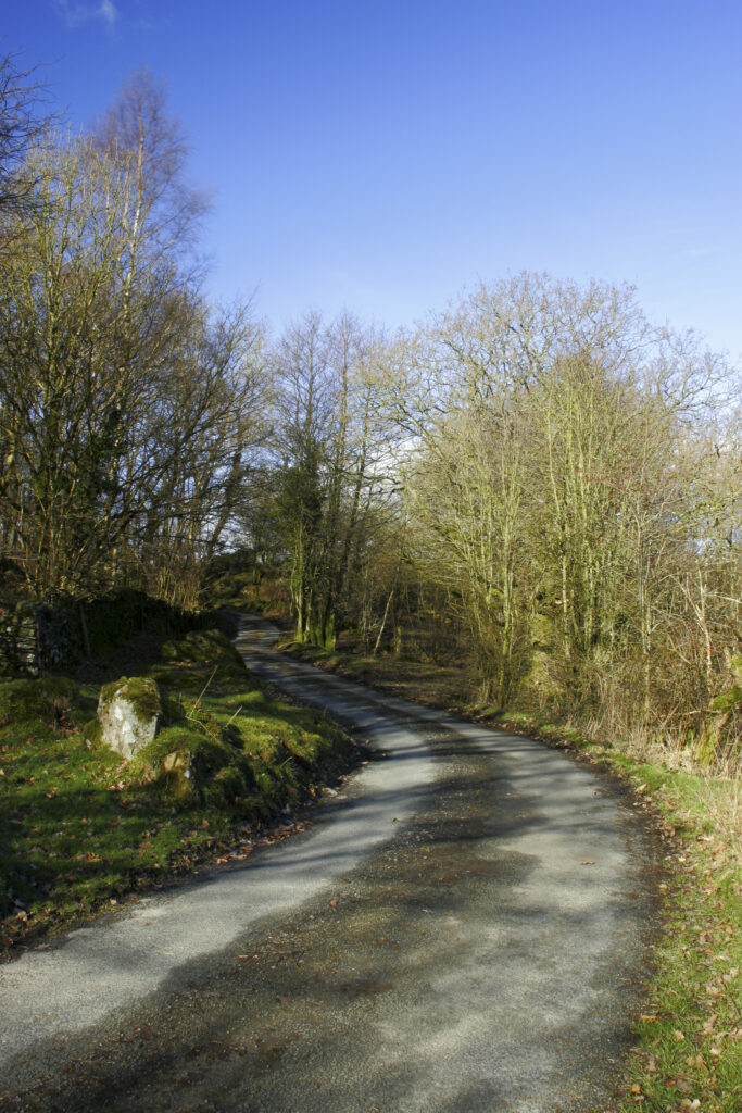 England, Cumbria, Lake District National Park. The Cumbria Way track follows the road from Kendall ground to Kiln Bank
