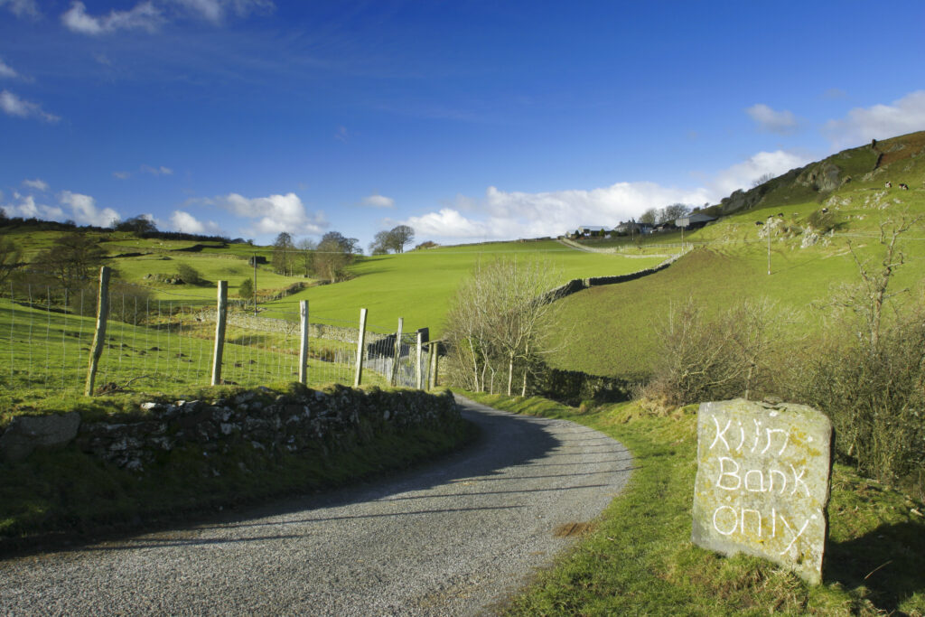England, Cumbria, Lake District National Park. The Cumbria Way track follows the road from Kendall ground to Kiln Bank