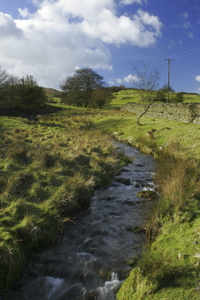 England, Cumbria, Lake District National Park. A small stream flowing close to the Cumbria Way track near Kiln Bank