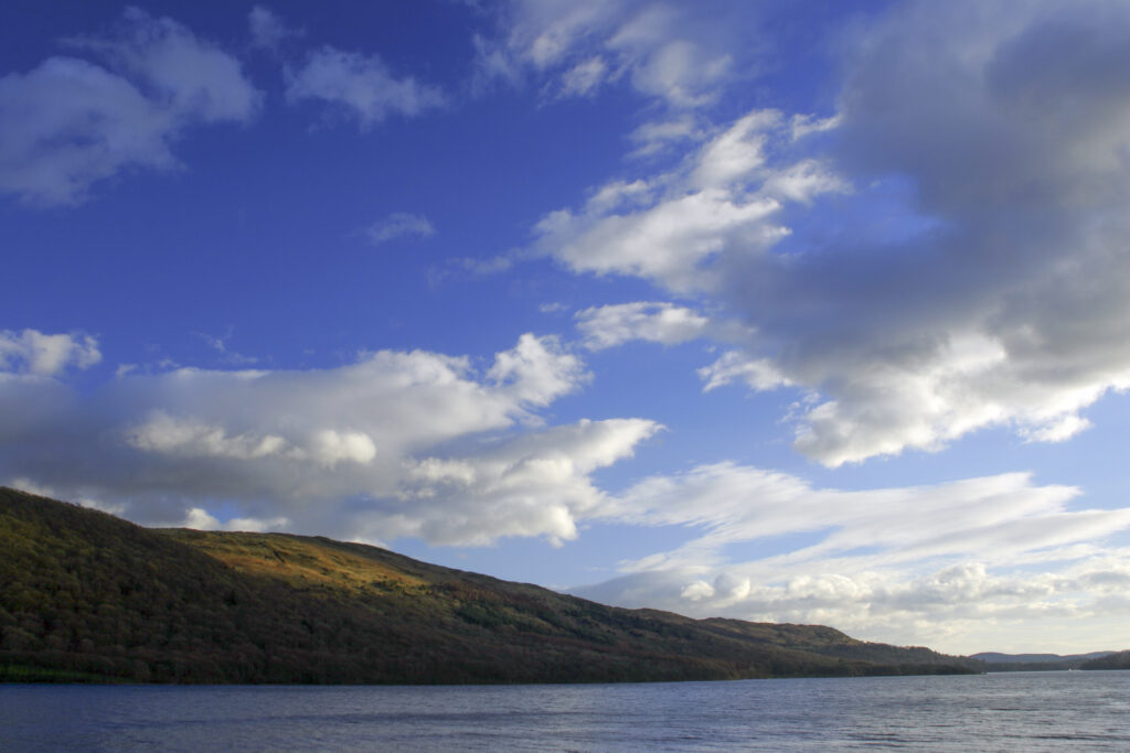 ENGLAND, Cumbria, Lake District National Park. Afternoon light illuminates the features of Coniston Water on the Cumbria Way