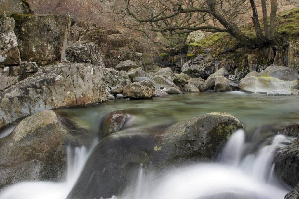 ENGLAND, Cumbria, Lake District National Park. The fast flowing waters of the Gallen Force near Stonethwaite.