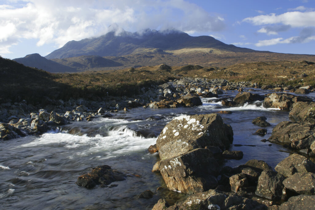 Scotland, The Isle of Skye, Sligachan. The River Sligachan flowing through the Glen Sligachan, dominated by the Cuillin Mountains.